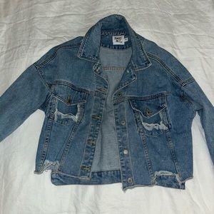 Distressed half cut Jean jacket.